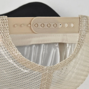 Detail of adjustable snapback closure and breathable mesh on the baseball cap