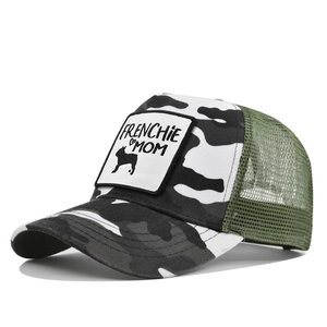 Detail of Frenchie Mom trucker hat featuring camo print and green breathable mesh