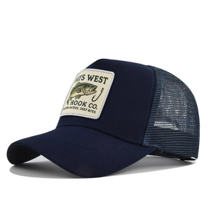 Detail of navy trucker hat with fish embroidery patch and breathable mesh back