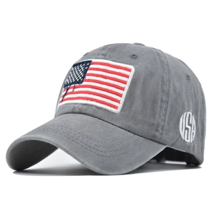 Detail of grey washed cotton baseball cap with USA flag embroidery and vintage textures