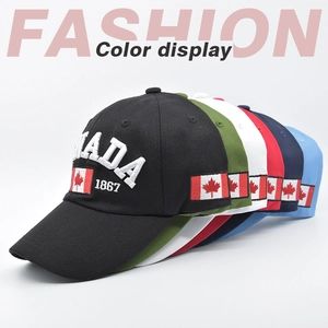 Detail showing various colors of baseball caps with Canada 1867 embroidery and maple leaf