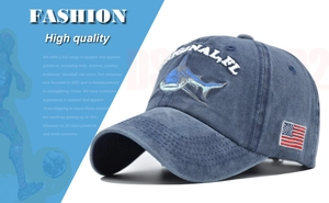 Detail of shark 3D embroidery and US flag patch on washed blue cotton baseball cap
