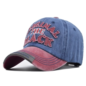 Detail of vintage washed baseball cap with 3D embroidery and distressed frayed edges
