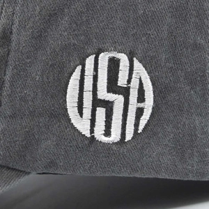 Detailed macro view of 3D USA embroidery on washed cotton baseball cap fabric texture