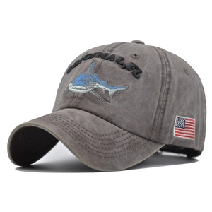 Detail view of 3D shark embroidery and Sanibel text on washed vintage baseball cap