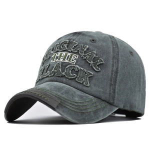 Detail of 3D embroidered ORIGINAL text on washed vintage baseball cap with green stitching