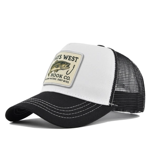 Close-up of black and white trucker hat featuring a fish embroidery patch and mesh back