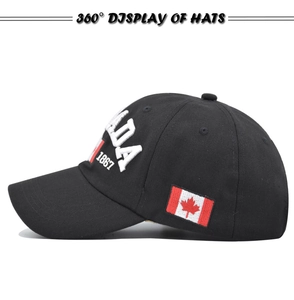 Side view of black cotton baseball cap with white CANADA 1867 embroidery and flag patch