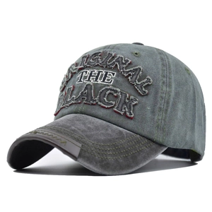 Detail of 3D embroidery ORIGINAL THE BLACK on washed gray vintage baseball cap