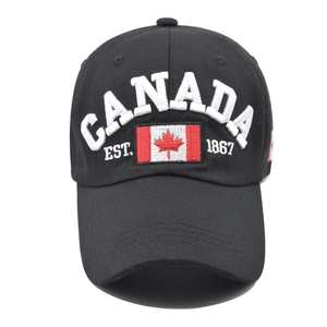 Close-up of 3D embroidery with CANADA text and flag on a black cotton baseball cap