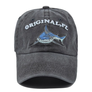 Detailed view of the 3D blue shark embroidery on a washed cotton vintage baseball cap
