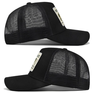 Detail view of the breathable mesh back and harvest patch on the black trucker hat
