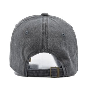 Close-up of vintage washed baseball cap back with adjustable metal buckle and grommets