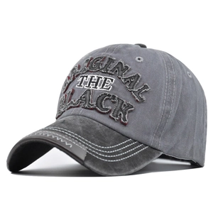Detail of 3D embroidered ORIGINAL text on washed grey vintage baseball cap brim