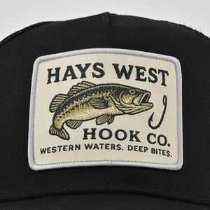 Close-up of rectangular vintage fishing patch with black bass on a black mesh cap