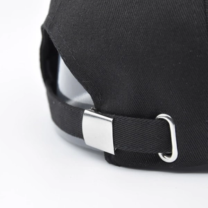 Black cotton baseball cap with adjustable silver metal buckle and strap on the back