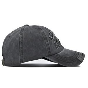 Detail of washed grey cotton baseball cap with 3D embroidery and metal buckle