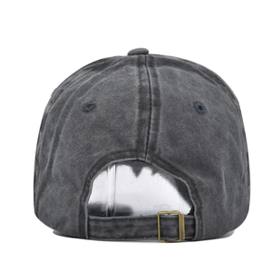 Detail of washed grey baseball cap back showing adjustable metal buckle and cotton texture