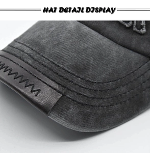 Detail showing washed grey baseball cap with five-row stitching and leather brim patch