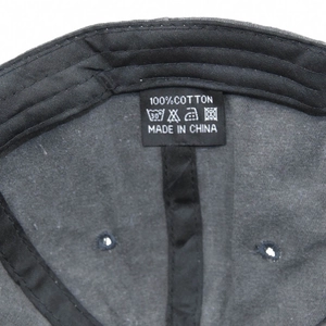 Detailed interior of vintage cotton baseball cap featuring 100% cotton label and stitching