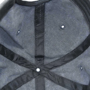 Macro shot of reinforced inner seams and rivets of a washed cotton baseball cap