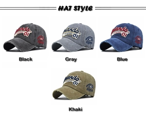 Detail of vintage washed baseball caps in black, gray, blue and khaki with 3D embroidery
