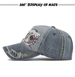 Detail showing grey washed cotton baseball cap with shark patch and anchor embroidery