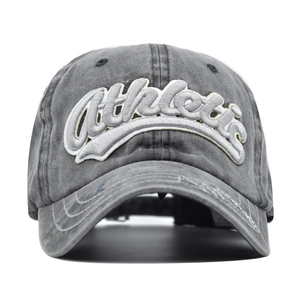 Detail shot of the 3D Athletic embroidery on a washed vintage grey baseball cap