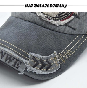 Close-up of washed cotton baseball cap brim with distressed holes and yellow stitching