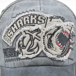Vintage washed gray baseball cap featuring 3D shark embroidery and distressed textures
