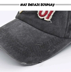 Detail view of washed canvas baseball cap featuring distressed edges and 3D embroidery