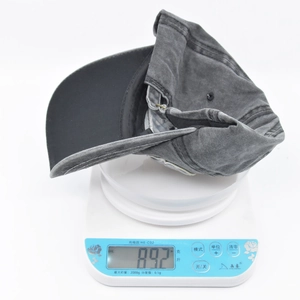 Detailed scale view showing the 89.2g weight of this washed dark grey cotton baseball cap