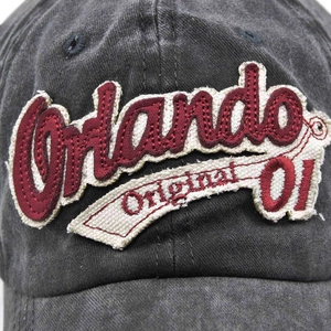 Close-up of vintage washed baseball cap with 3D embroidery Orlando and frayed patches