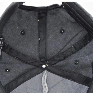 Detail view of the washed baseball cap interior with reinforced seams and care label