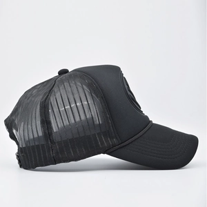 Side view of a structured black trucker hat with breathable mesh and curved visor