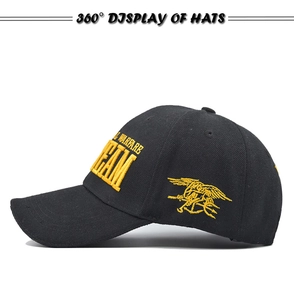 Detail of yellow embroidery showing Trident logo on black SEAL TEAM tactical baseball cap