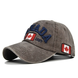 Detail view of the embroidered Canada flag and 1867 text on a washed cotton baseball cap