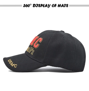 Close-up of high-quality yellow USMC embroidery on a black cotton tactical baseball cap
