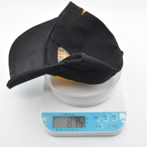 Lightweight black tactical baseball cap weighing only 87.5g on a digital scale