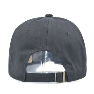 Detail view of black cotton baseball cap with adjustable metal slider and breathable eyelets