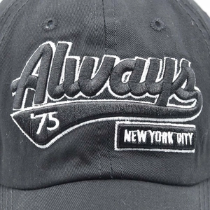 Close-up of white 3D embroidery Always 75 New York City on black cotton baseball cap