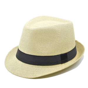 Detailed close-up of woven straw fedora hat texture with classic black ribbon band