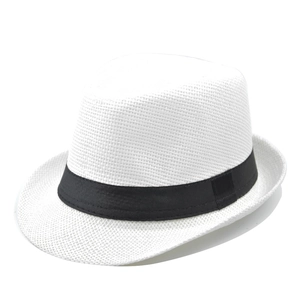 Close-up of the fine woven texture and black ribbon detail on a white straw jazz hat