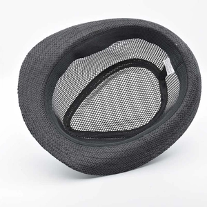 Interior detail of black straw fedora showing breathable mesh lining and 58cm size label