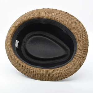 Macro view of inner sweatband and 100% paper fiber label inside the vintage straw hat