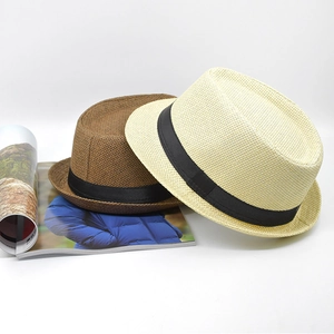 Vintage straw trilby hats in beige and brown colors with decorative black ribbon bands