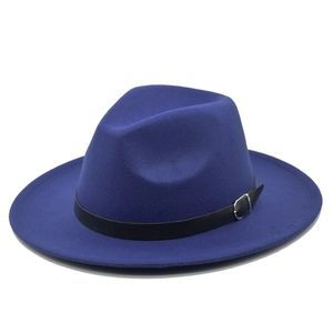 Detail of royal blue fedora hat with black faux leather band and silver buckle
