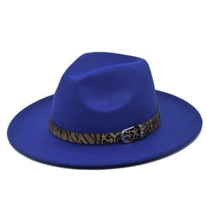 Detailed view of navy blue wool fedora hat with leopard print band and metal buckle