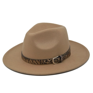 Close-up of leopard print band and silver metal buckle on camel wool fedora hat