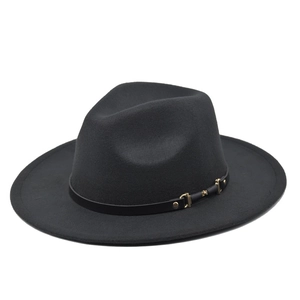 Close-up of black wool fedora featuring a leather band with gold buckle and stud detail